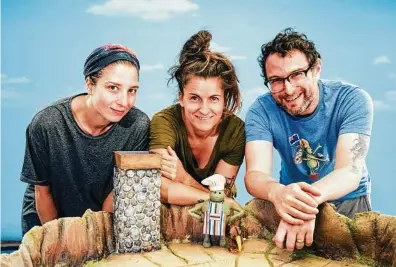  ??  ?? Ozlem Akturk, from left, Rachel Larsen and Adam Reid are the creators of “The Tiny Chef Show.” Since his first appearance on social media last fall, the Tiny Chef has amassed a cult following with a series of stop-motion cooking videos. He is now poised to conquer even more media platforms.