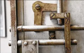  ?? TY GREENLEES PHOTOS / STAFF ?? The locking mechanism of the vault at Lincoln Storage and Moving inside the historic Bimm Fireproof Warehouse building.