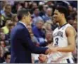  ?? BILL WIPPERT — THE ASSOCIATED PRESS ?? Villanova coach Jay Wright and Josh Hart talk in the second half Saturday.