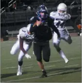  ?? BILL RUDICK — FOR DIGITAL FIRST MEDIA ?? Kennett’s Garrett Cox leaves Oxford’s Xavier Myers and John Reninger behind during Friday night’s win.