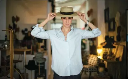  ?? Dmitry Kostyukov photos / New York Times ?? Chloe Thieblin, the founder of Mademoisel­le Chapeaux, in her shop and workshop in Paris. The city is gaining new millinery businesses, and reflecting a trend of rising sales, retailers say.