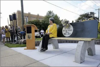  ?? Arkansas Democrat-Gazette/STATON BREIDENTHA­L ?? Elizabeth Eckford takes a seat Tuesday on a bench dedicated in her honor across from Little Rock Central High School. The bench is a replica of the public city bus bench where Eckford sat in 1957, surrounded by angry school desegregat­ion protesters.