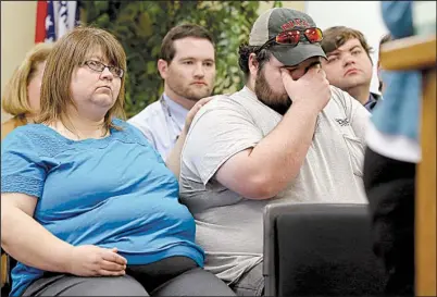  ?? Arkansas Democrat-Gazette/STEPHEN B. THORNTON ?? Melissa Cassidy (left) comforts her nephew, Jonathan Erickson, during testimony about death-row inmate Stacey Johnson at a Parole Board hearing Friday in Little Rock. Johnson killed Carol Heath, Cassidy’s sister and Erickson’s mother, in 1993.