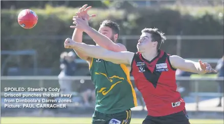  ??  ?? SPOILED: Stawell’s Cody Driscoll punches the ball away from Dimboola’s Darren Jones. Picture: PAUL CARRACHER