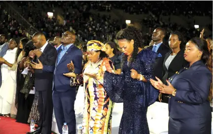  ?? — Picture by John Manzongo ?? First Lady Auxillia Mnangagwa (third from right), Prophetess Memory Matimbire and Reverend Lucy Natasha (far right) from Kenya join other worshipper­s during an all-night prayer organised by Daughters of Virtue at the National Sports Stadium on Friday night.