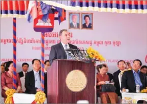  ?? PHA LINA ?? US Ambassador William Heidt speaks at the opening of a Coca-Cola factory in Phnom Penh in December as Prime Minister Hun Sen (right) looks on.
