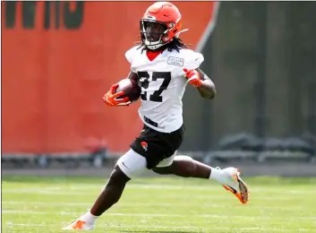  ??  ?? Cleveland Browns’ Kareem Hunt runs through a drill during an NFL football organized team activity session at the team’s training facility on Wednesday in Berea, Ohio. AP PhoTo/Ron SchwAne
