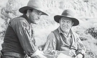  ?? THE CANADIAN PRESS ?? Joaquin Phoenix, left, and John C. Reilly star in the film adaptation of Patrick deWitt’s award-winning novel, "The Sisters Brothers," a dark comic Western about two brothers who are assassins.