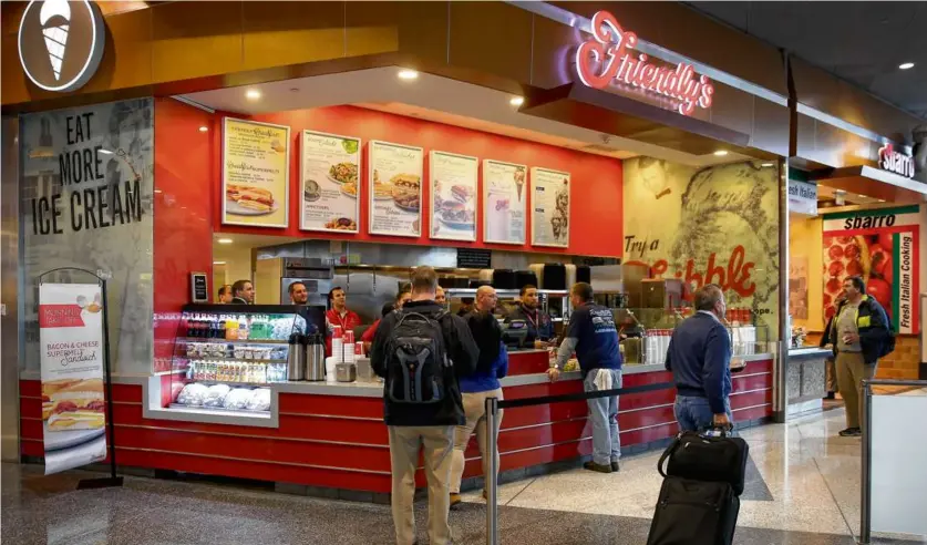  ?? DAVID L. RYAN/BOSTON GLOBE ?? The Friendly’s at Logan Airport on opening day in 2015. Then-Mayor Marty Walsh and then-Friendly’s CEO John Maguire attended the festivitie­s. The location closed in 2024.