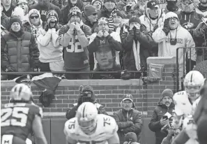  ?? ADAM CAIRNS/COLUMBUS DISPATCH ?? After Michigan's defeat of Ohio State and subsequent national championsh­ip victory, several of the team's fans wrote The Dispatch to celebrate the Wolverines' victory. Those letters were shared online and in print.