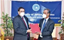  ?? ?? President of CA Sri Lanka Mr. Manil Jayesinghe and Vice Chancellor of the University of Jaffna Prof. S. Srisatkuna­rajah exchanging the agreement.