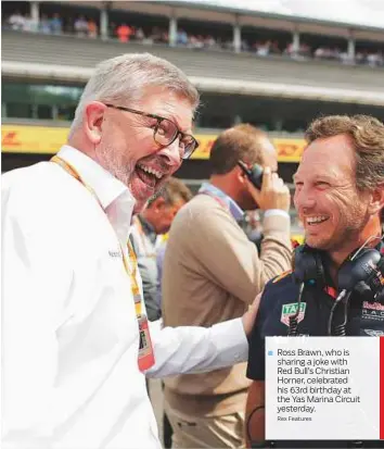  ?? Rex Features ?? Ross Brawn, who is sharing a joke with Red Bull’s Christian Horner, celebrated his 63rd birthday at the Yas Marina Circuit yesterday.
