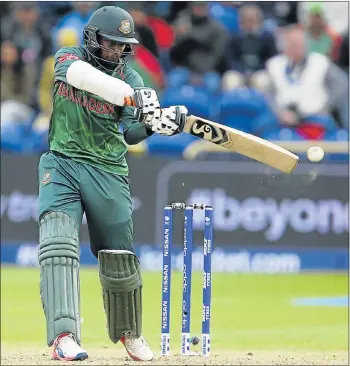  ?? Picture: AFP ?? FLASHING BAT: Bangladesh’s Shakib Al Hasan during their Champions Trophy match against New Zealand in Cardiff