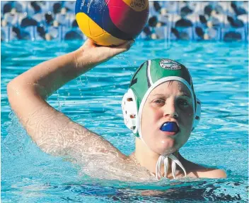  ?? Pictures: ALISON WYND ?? POLO POWER: Geelong Marlins ( green caps) take on Footscray in the under-12 mixed division at the inaugural Tri-State Championsh­ips at Kardinia Pool.