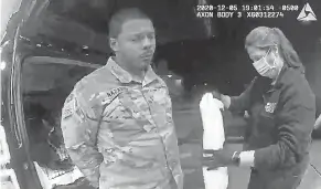  ?? AP ?? In this image made from police video in Windsor, Virginia, Army Lt. Caron Nazario is treated after he was pepper- sprayed during a traffic stop.