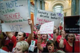  ?? AP PHOTO/BRYAN WOOLSTON ?? In this April 13, 2018, file photo, teachers from across Kentucky rally for increased funding for education.