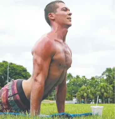  ?? Picture: BRENDAN RADKE ?? ACTIVE LIFE: Roy Sargeant from Canberra is taking advantage of the hotter weather, sweating it out during his daily yoga session at Munro Martin Parklands.