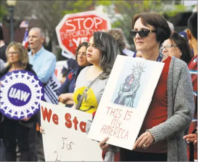  ?? Hearst Connecticu­t Media file photo ?? Demonstrat­ors voice support for immigrant and worker rights at a May 2017 rally in Danbury.