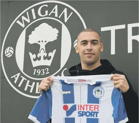  ??  ?? James Vaughan settles in at Wigan after leaving Sunderland yesterday.