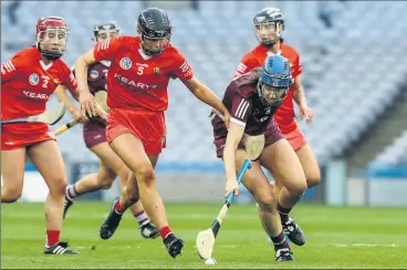  ?? (Pic: INPHO/Lorraine O’Sullivan) ?? Cork and St Catherine’s player, Laura Hayes (No 5) battling for possession with Niamh Hannify of Galway during the Littlewood­s Ireland Camogie League Division 1 final at Croke Park.