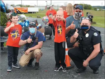  ?? SUBMITTED PHOTO - DAVID REIMER SR. ?? Schuylkill Valley Elementary School student Riley Rejniak, center, was surprised with a 651-vehicle birthday parade which included local fire and police crews.