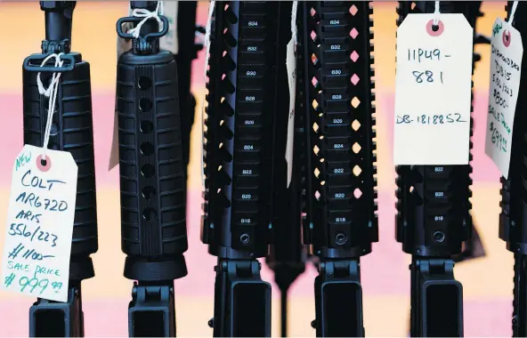  ?? DOMINICK REUTER/AFP/GETTY IMAGES FILES ?? The slick ads by major gun makers are typically big drivers of sales ahead of Black Friday. Gun-control activists are raising alarm over the potential of such ads to inspire the next shooter, while gun-rights advocates say the problem is deranged...