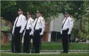  ?? BY CARL HESSLER JR. — MEDIANEWS GROUP ?? Members of the Philadelph­ia Police Department preparing to present a rifle salute during annual Montgomery County Police Memorial Ceremony.