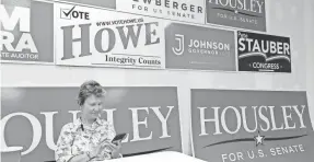  ?? NORA HERTEL/ ST. CLOUD TIMES ?? Republican volunteer Deborah Jackson makes calls for the primary election from the GOP office in Duluth, Minn., on Aug. 22.