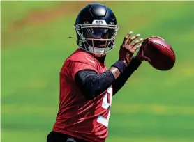  ?? DALE ZANINE/USA TODAY SPORTS ?? Atlanta Falcons quarterbac­k Michael Penix Jr. passes the ball during the Falcons’ rookie minicamp on Friday.