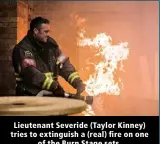  ?? ?? Lieutenant Severide (Taylor Kinney) tries to extinguish a (real) fire on one of the Burn Stage sets.