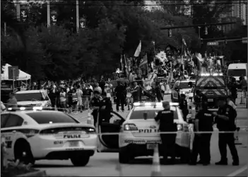  ?? Chris Day/South Florida Sun-Sentinel via AP ?? Police and firefighte­rs respond after a truck drove into a crowd of people injuring them during The Stonewall Pride Parade and Street Festival in Wilton Manors, Fla., on Saturday.