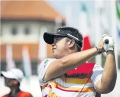  ??  ?? Kiradech Aphibarnra­t plays a shot during a practice round yesterday.