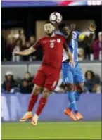  ?? MARCIO JOSE SANCHEZ — THE ASSOCIATED PRESS ?? The United States’ Clint Dempsey, left, goes up for a head ball next to Honduras’ Maynor Figueroa during the first half Friday in San Jose, Calif.