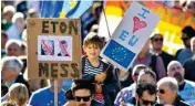  ??  ?? A young boy holding a sign proclaimin­g support for the EU