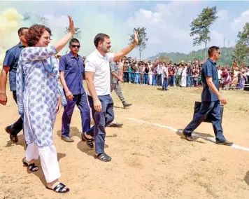  ?? (ANI) ?? Rahul Gandhi greets supporters with Priyanka Gandhi Vadra during a roadshow prior to filing nomination papers, in Wayanad, Kerala, on Wednesday