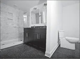  ?? [TOM DODGE/DISPATCH] ?? The master bath inside a LeVeque Tower condominiu­m