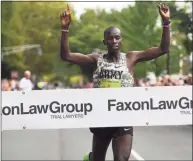  ?? Brian Pounds / Hearst Connecticu­t Media ?? Defending champion Leonard Korir breaks the tape to win his third Faxon Law New Haven Road Race in New Haven in 2019.