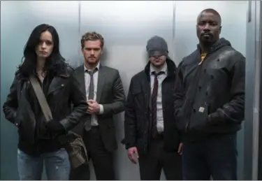  ?? NETFLIX PHOTOS ?? Krysten Ritter, Finn Jones, second from left, Charlie Cox, Mike Colter star in “Marvel’s The Defenders” on Netflix.