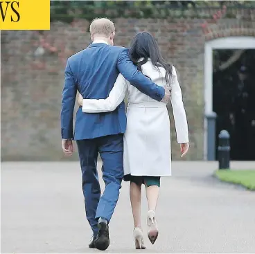  ?? ALASTAIR GRANT / THE ASSOCIATED PRESS ?? Britain’s Prince Harry, who is fifth in line for the British throne, strolls with Meghan Markle on the grounds of Kensington Palace Monday, after the announceme­nt that they will marry in the spring.