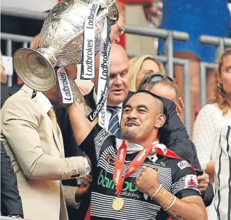  ??  ?? ■
Hull’s Mahe Fonua celebrates with the Challenge Cup yesterday.