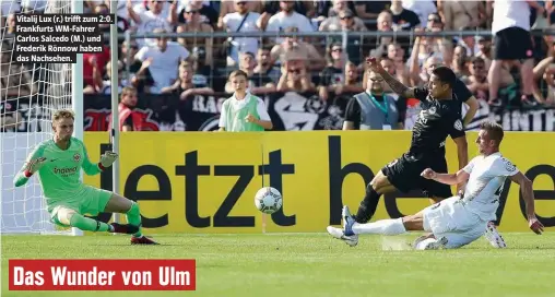  ??  ?? Vitalij Lux (r.) trifft zum 2:0. Frankfurts WM-Fahrer Carlos Salcedo (M.) und Frederik Rönnow haben das Nachsehen.