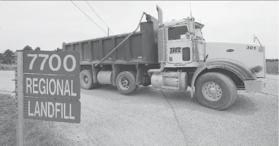  ?? PHOTOS: DAN JANISSE ?? A dump truck exits the Essex-Windsor Regional Landfill in Essex. Officials are trying to forge a compromise on how to run the Essex Windsor Solid Waste Authority.