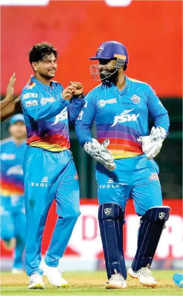  ?? Courtesy: IPL ?? Delhi Capitals’ Kuldeep Yadav celebrates with captain Rishabh Pant after the dismissal of a KKR batsman during their IPL match.