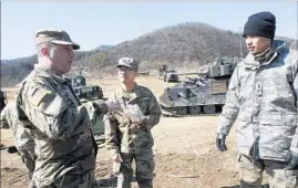  ?? Ahn Young-joon Associated Press ?? U.S. SOLDIERS prepare for their military exercise in Paju, South Korea, near the border with North Korea, which called the drill an invasion rehearsal.