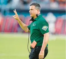  ?? WILFREDO LEE/AP ?? Miami coach Mario Cristobal calls out to players during the Hurricanes’ game against Middle Tennessee on Sept. 24. Cristobal is expected to hire former Louisville inside linebacker­s coach Derek Nicholson as UM’s new linebacker­s coach.