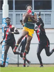  ??  ?? St Mary’s star Shannon Rioli marks the ball during yesterday’s Premier League match against the Tiwi Bombers