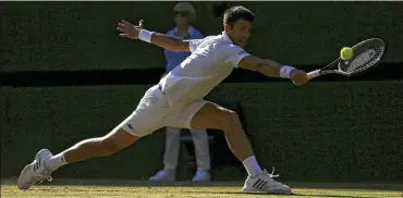  ?? TIM IRELAND / AP ?? After an early spat with the chair umpire, second-seeded Novak Djokovic (above) dispatched Latvia’s Ernests Gulbis in straight sets Saturday at Wimbledon. Djokovic earned his 10th appearance in the tourney’s second week.