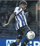  ??  ?? On target: Kadeem Harris swoops for Sheffield Wednesday’s only goal