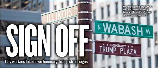  ?? | SUN- TIMES FILE PHOTO ?? Over the weekend, city workers removed the two remaining honorary “Trump Plaza” street signs.