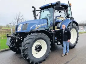  ??  ?? Pictured is Peter Plehov with one of the tractors that he and Phil Gibson of the Blue Force tractor club will be driving more than 5,000 miles to raise money for Shepshed charity Steps.